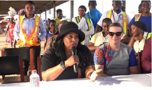 Jennifer R. Littlejohn at Tema Fishing Harbour (holds mic)